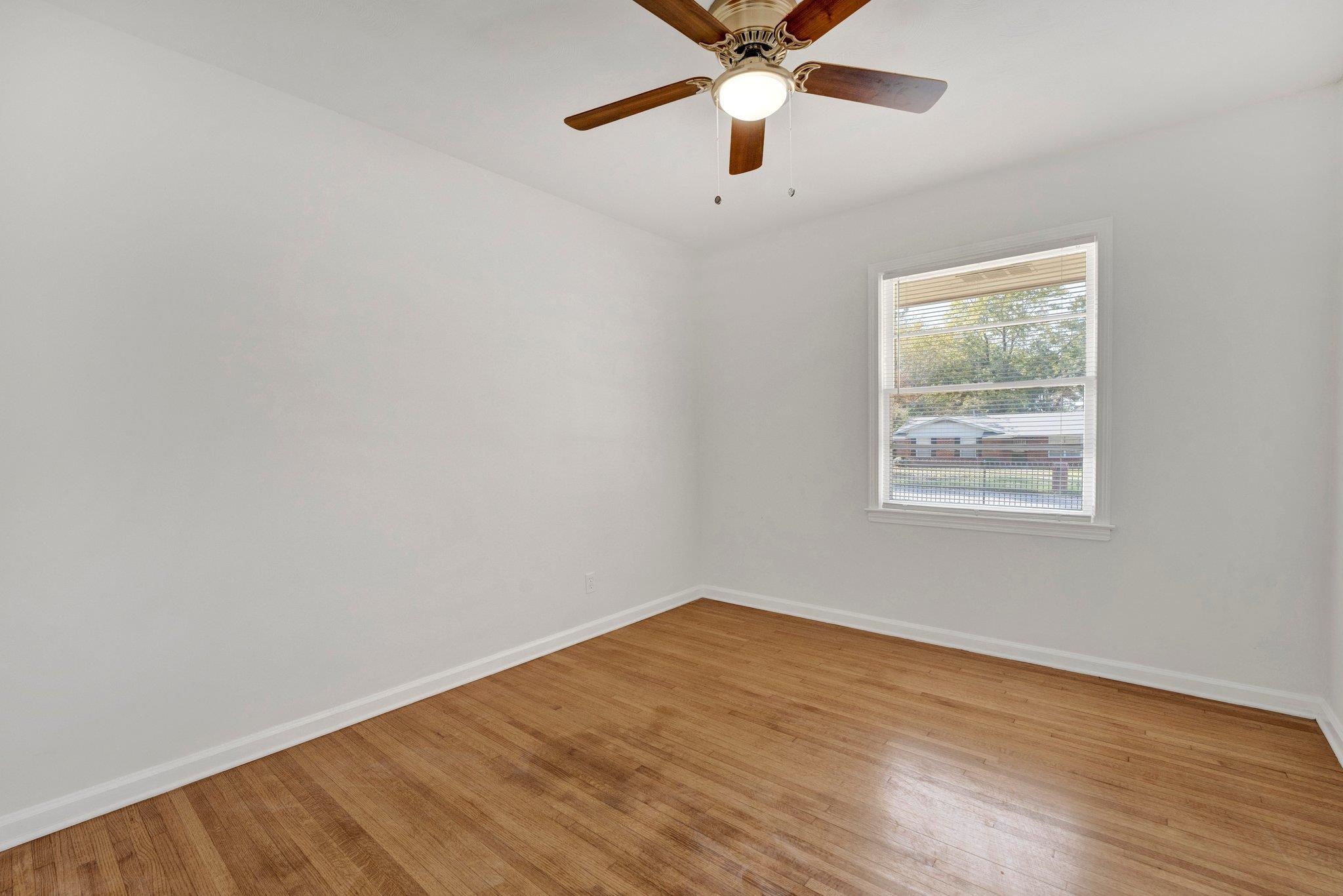 4382 Ruth Drive Memphis, TN 38109 - Photo 23 of 32 Unfurnished room with ceiling fan and light wood-type flooring
