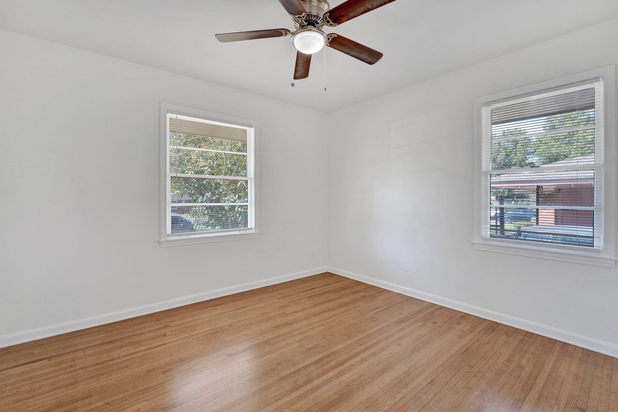4382 Ruth Drive Memphis, TN 38109 - Photo 24 of 32 Spare room featuring light hardwood / wood-style flooring, a healthy amount of sunlight, and ceiling fan