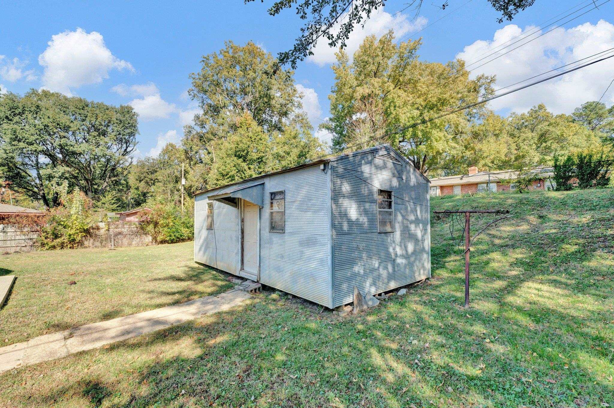 4382 Ruth Drive Memphis, TN 38109 - Photo 30 of 32 View of outbuilding with a lawn