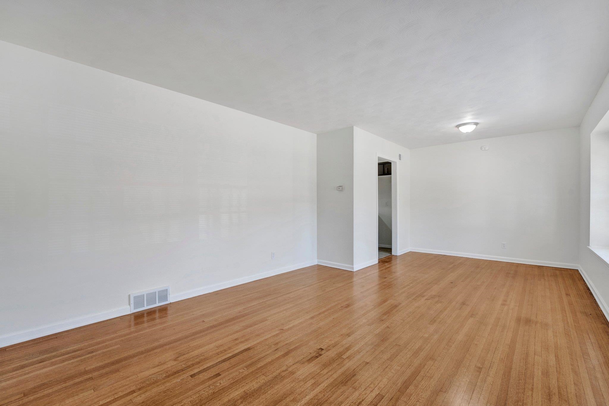 4382 Ruth Drive Memphis, TN 38109 - Photo 6 of 32 Empty room with light wood-type flooring