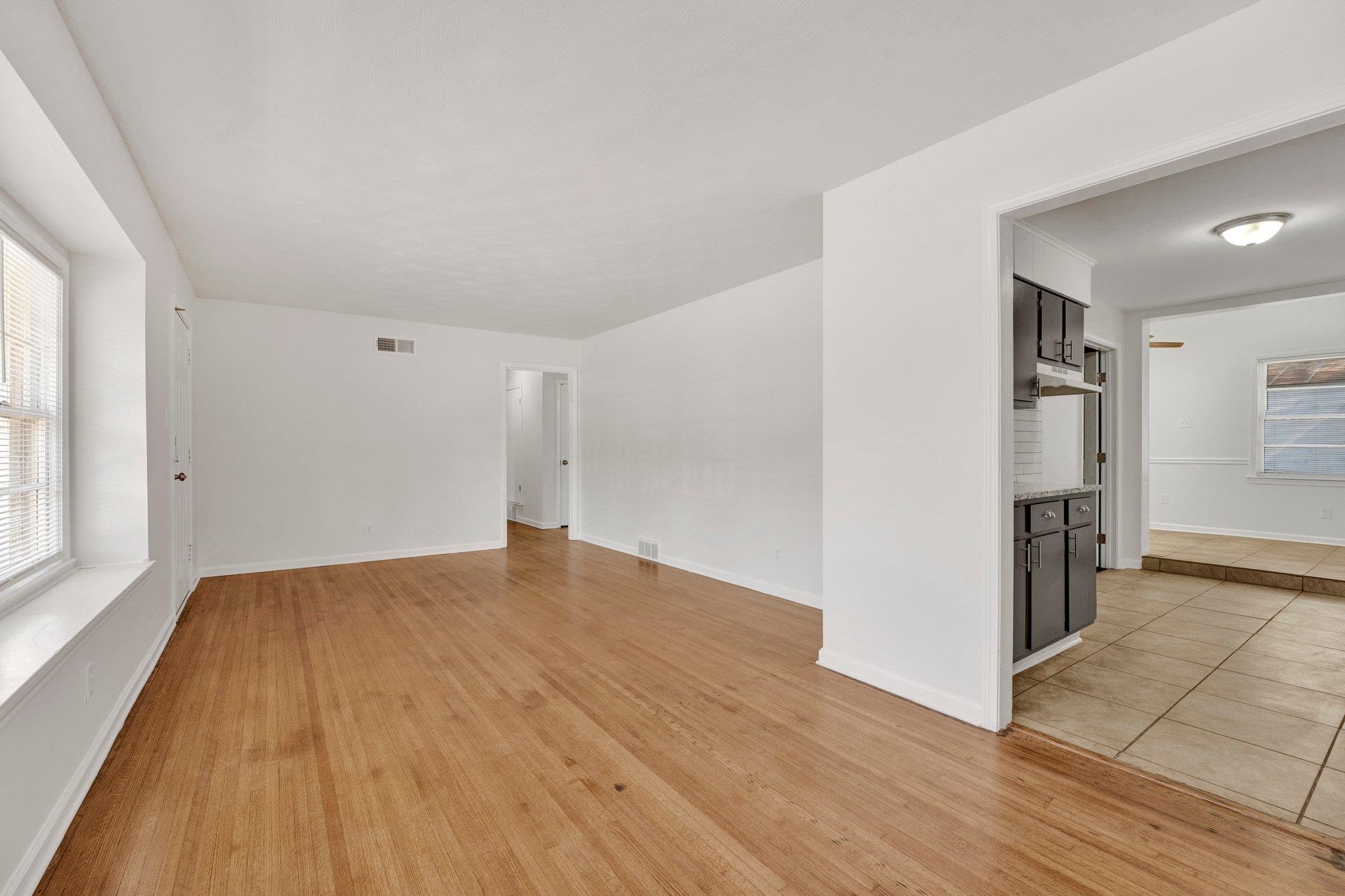 4382 Ruth Drive Memphis, TN 38109 - Photo 8 of 32 Empty room with light hardwood / wood-style floors and a wealth of natural light