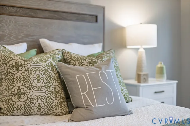 a bed room with a bed and a lamp