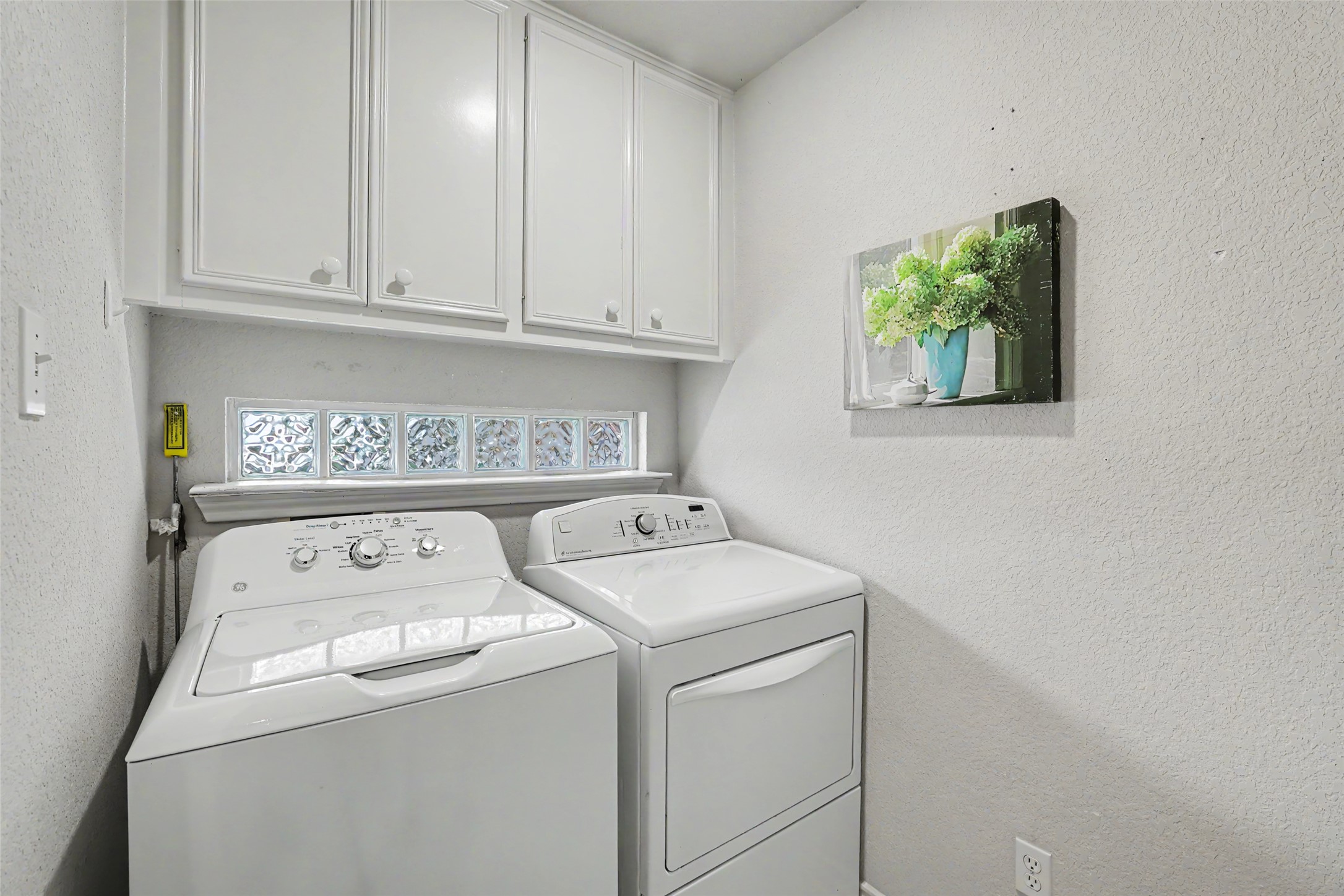 30107 Hamlet Circle Georgetown, TX 78628 - Photo 14 of 40 Functional utility room featuring upper cabinetry and a glass block window.