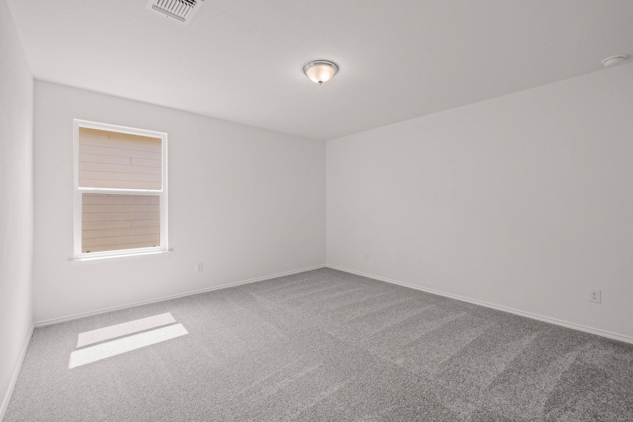 260 Feathers Street Jarrell, TX 76537 - Photo 24 of 34 an empty room with windows