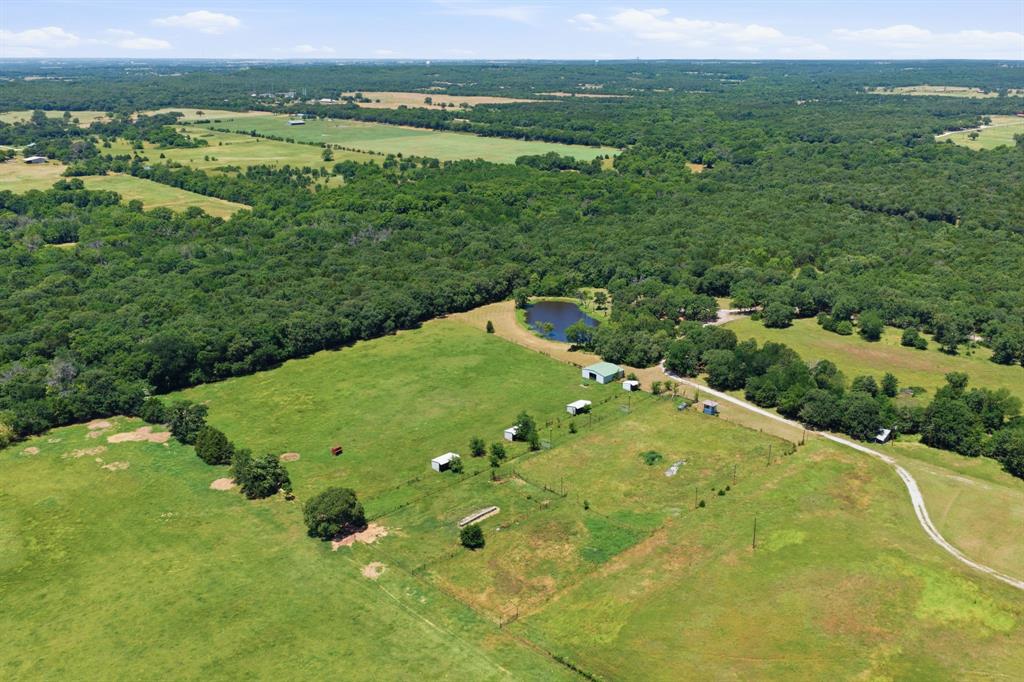 321 Cr 211 Road Gainesville, TX 76240 - Photo 34 of 40 Lots of trees surrounding the arena , barn and loafing sheds.