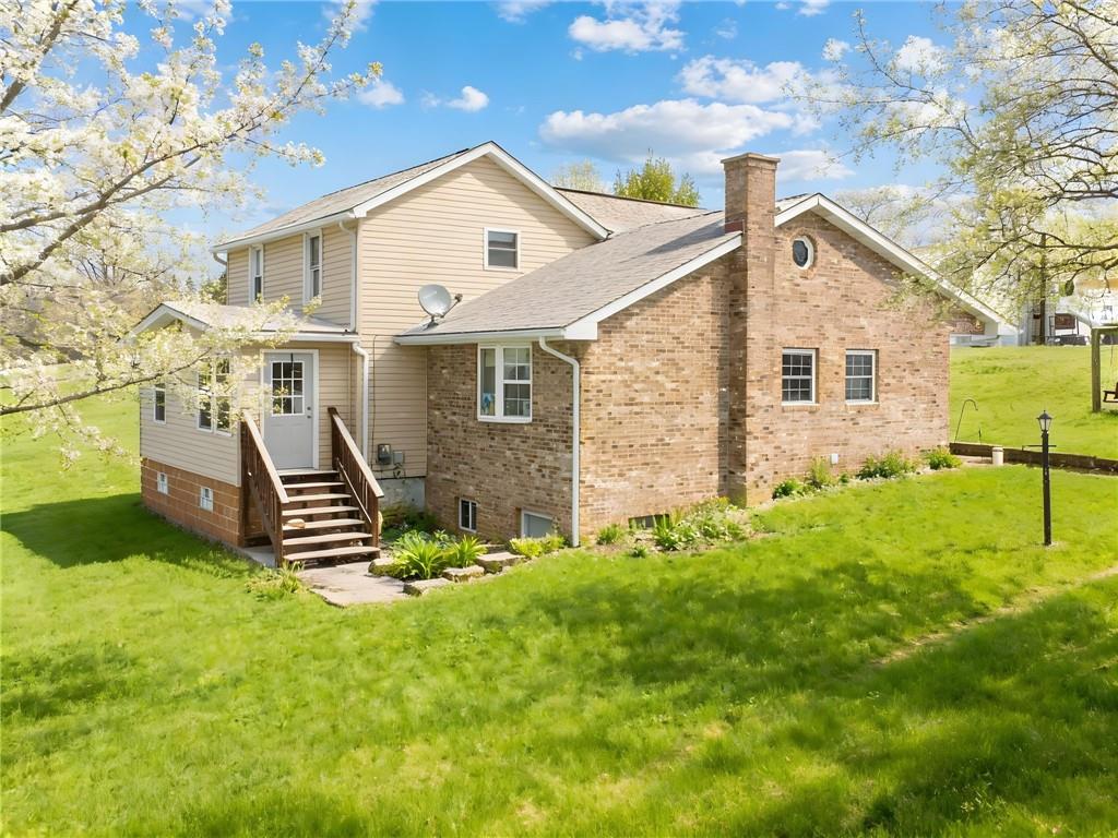 a front view of a house with a yard