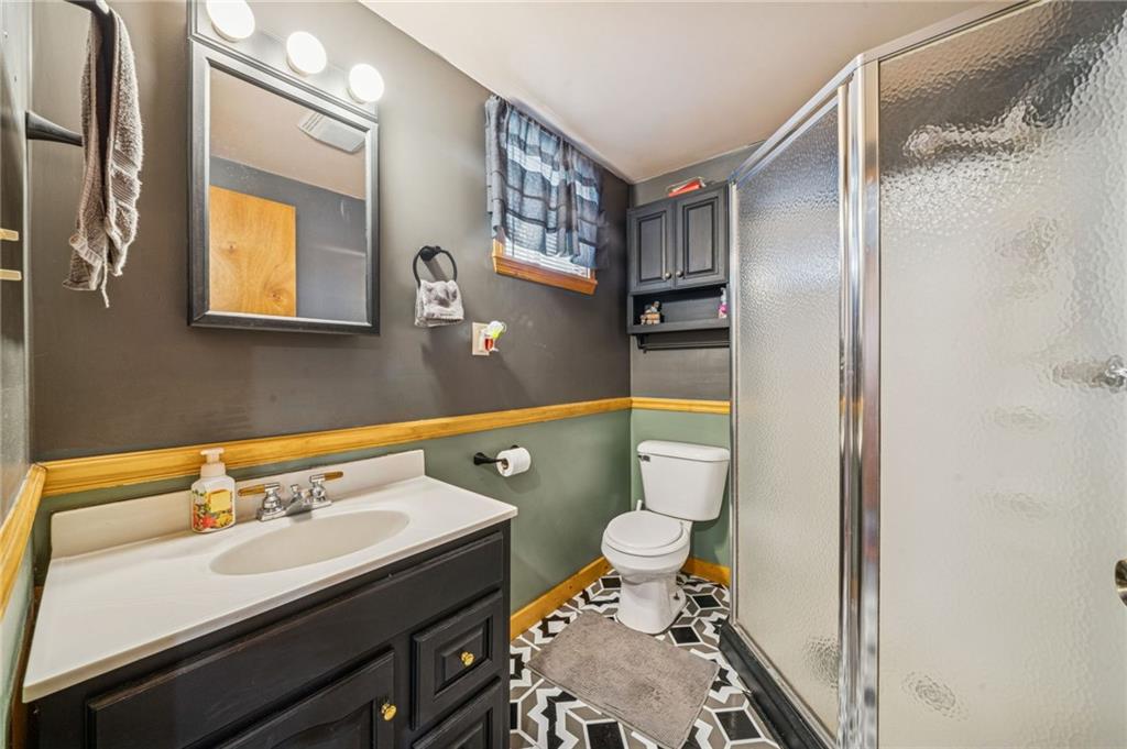 144 Double Hill Road Mount Pleasant, PA 15666 - Photo 11 of 41 a bathroom with a sink and a mirror