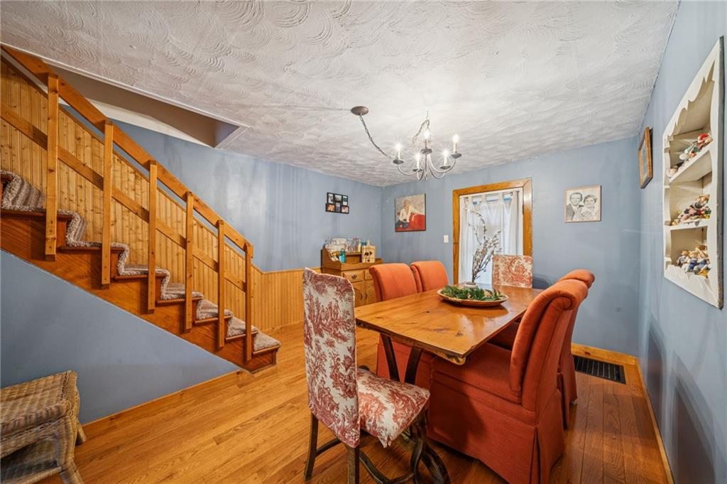 144 Double Hill Road Mount Pleasant, PA 15666 - Photo 12 of 41 a view of a dining room with furniture and a chandelier