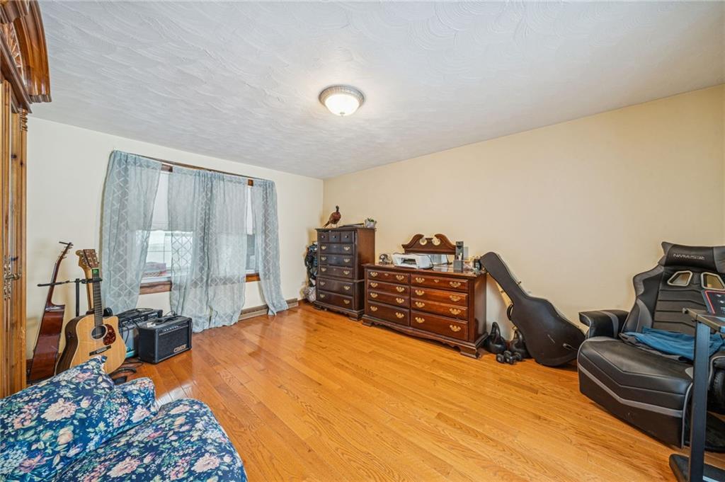 144 Double Hill Road Mount Pleasant, PA 15666 - Photo 14 of 41 a bed room with a bed and a chair