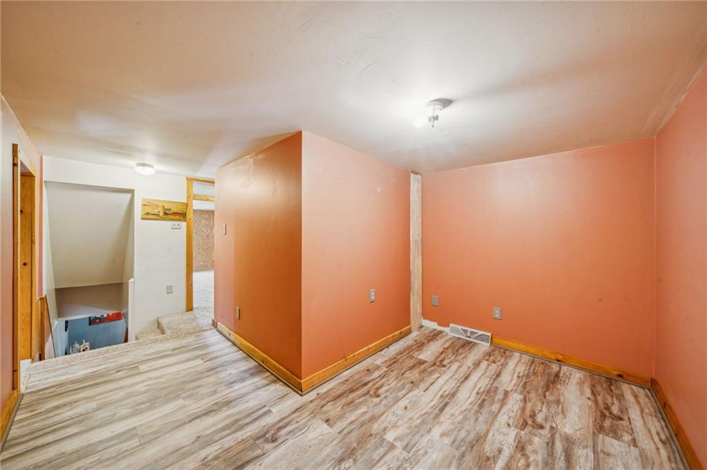 144 Double Hill Road Mount Pleasant, PA 15666 - Photo 20 of 41 a view of empty room with wooden floor