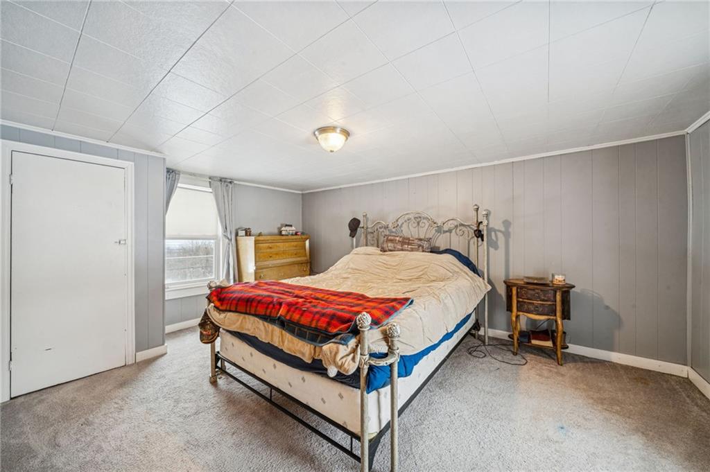 144 Double Hill Road Mount Pleasant, PA 15666 - Photo 22 of 41 a bed room with a bed and window