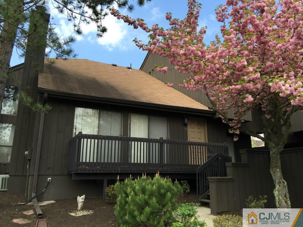 136 Westgate Drive Edison, NJ 08820 - Photo 1 of 19 a front view of a house with a garden