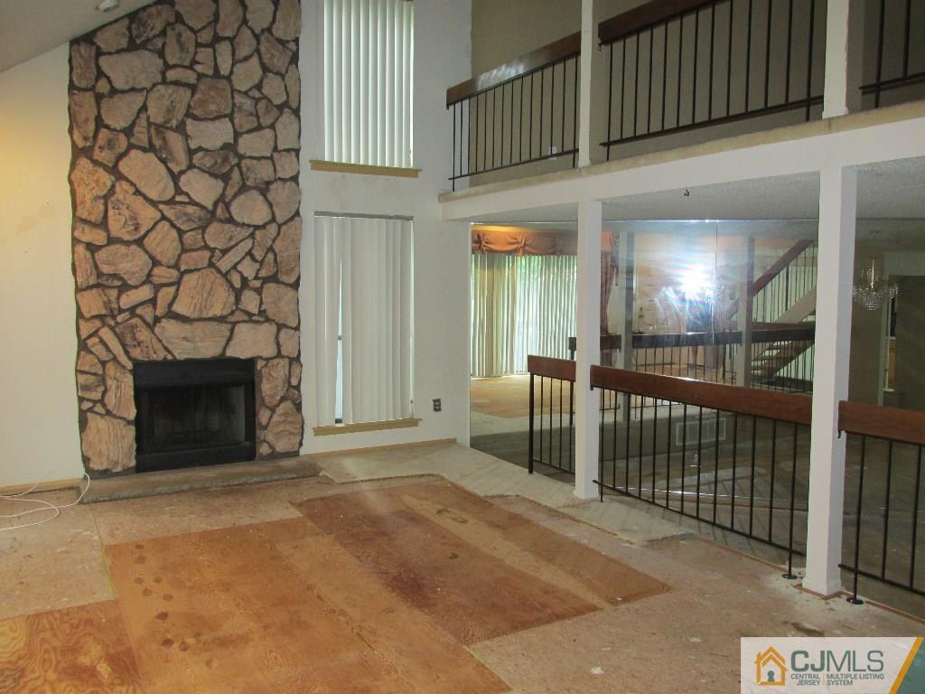 136 Westgate Drive Edison, NJ 08820 - Photo 5 of 19 a view of a livingroom with a fireplace