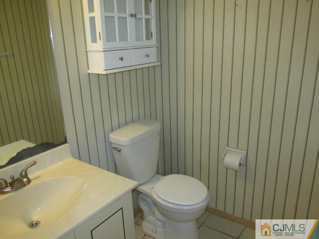 136 Westgate Drive Edison, NJ 08820 - Photo 8 of 19 a bathroom with a sink a toilet and shower