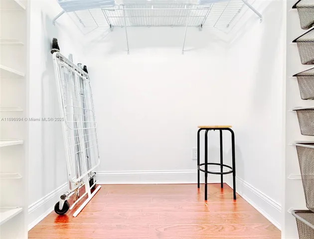 a view of staircase with white walls and a window