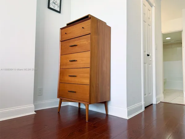 an empty room with wooden floor