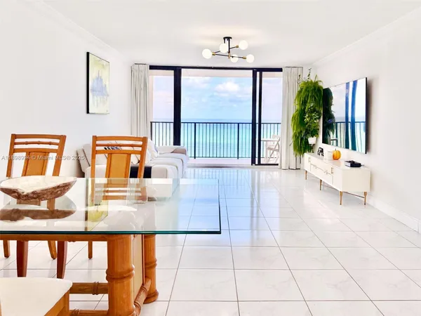a hallway with a large window and pool table