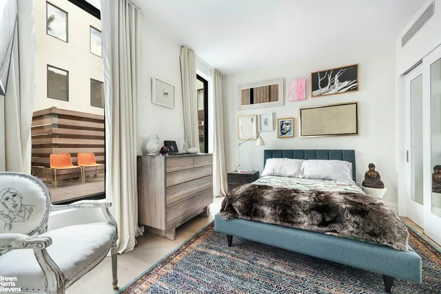 a room with a bed and furniture