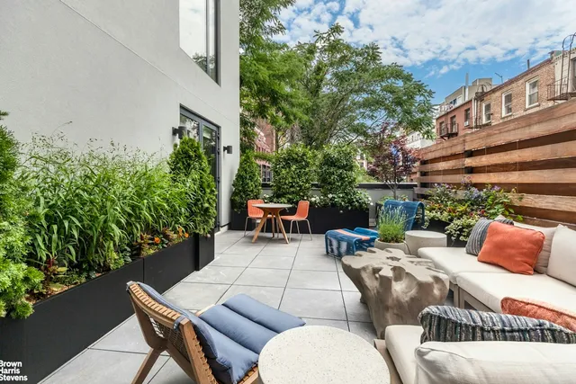 a outdoor living space with furniture and plants