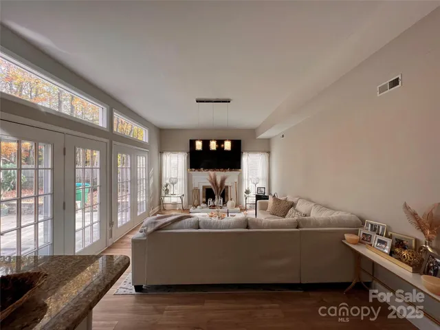 a bedroom with a large window and walk in closet