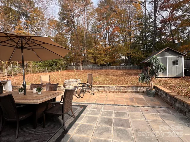 a view of a backyard with sitting area