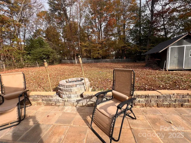a view of a house with swimming pool and a yard