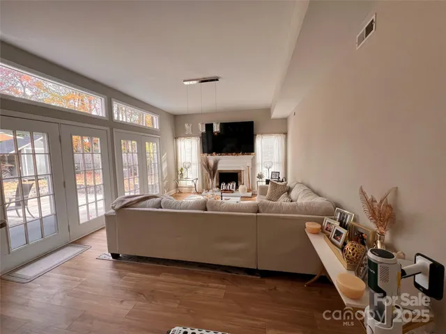 a view of a dining room with furniture and windows