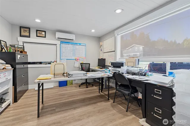 a living room with furniture a rug and a table