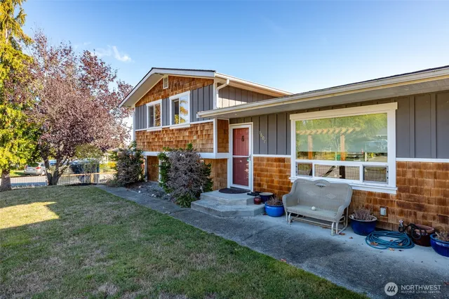 a front view of house with outdoor seating
