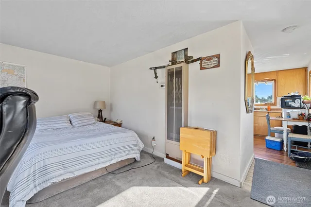 a bedroom with a bed and a view of bathroom