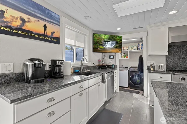 a kitchen with counter top space cabinets and stainless steel appliances