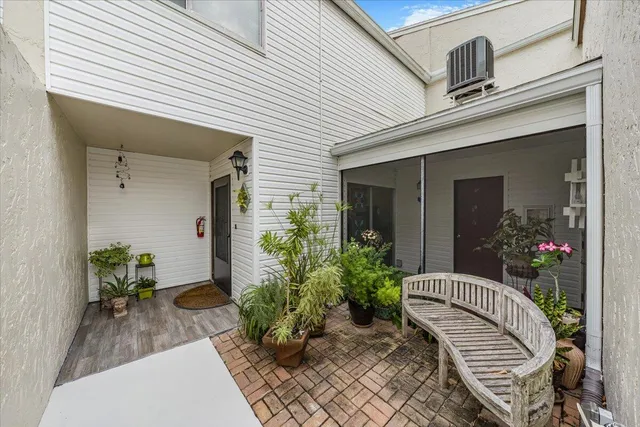 a view of a swimming pool with a patio