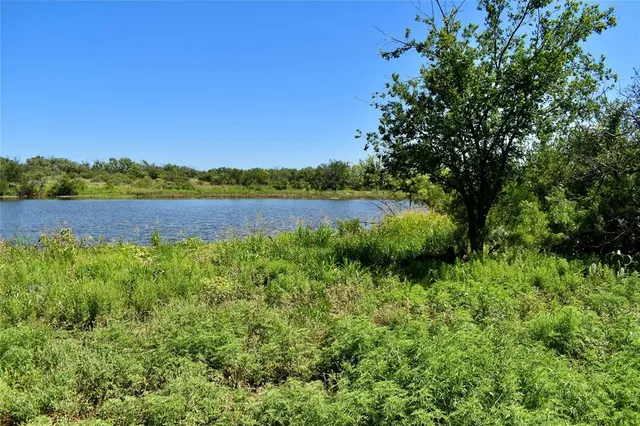 a view of lake with mountain in the background