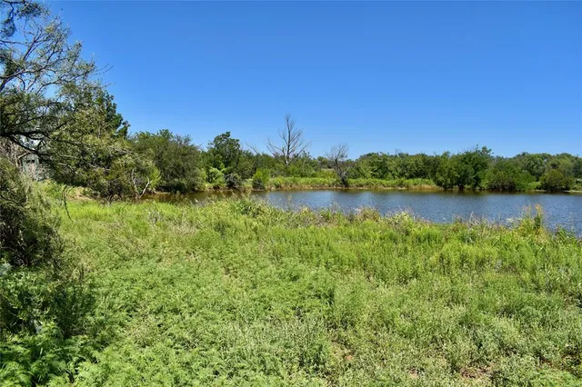 a view of a lake with a big yard