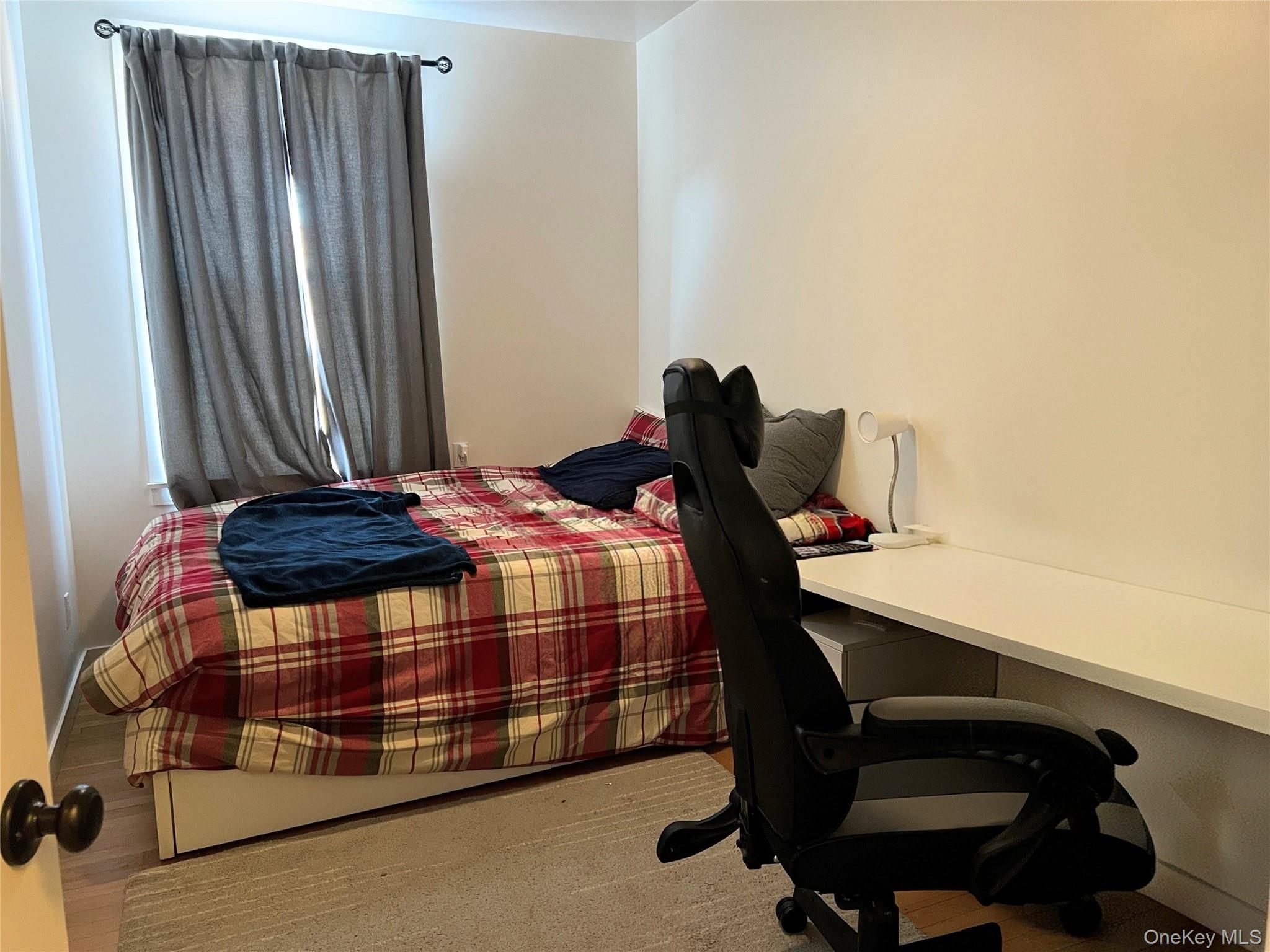 64 Sagamore Road, Unit E6 Bronxville, NY 10708 - Photo 16 of 18 a bedroom with a bed and a desk