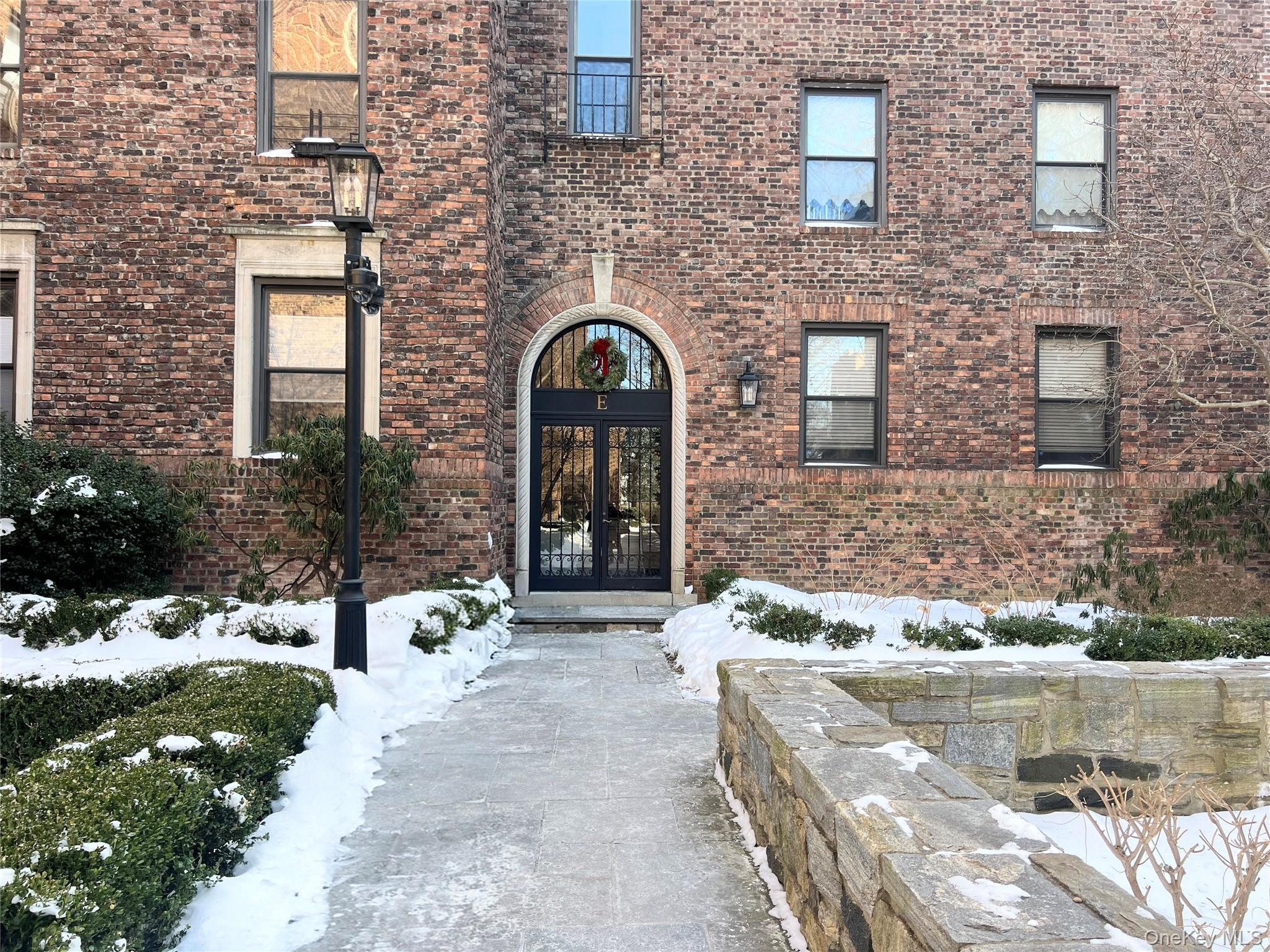 64 Sagamore Road, Unit E6 Bronxville, NY 10708 - Photo 2 of 18 a front view of a house with outdoor space