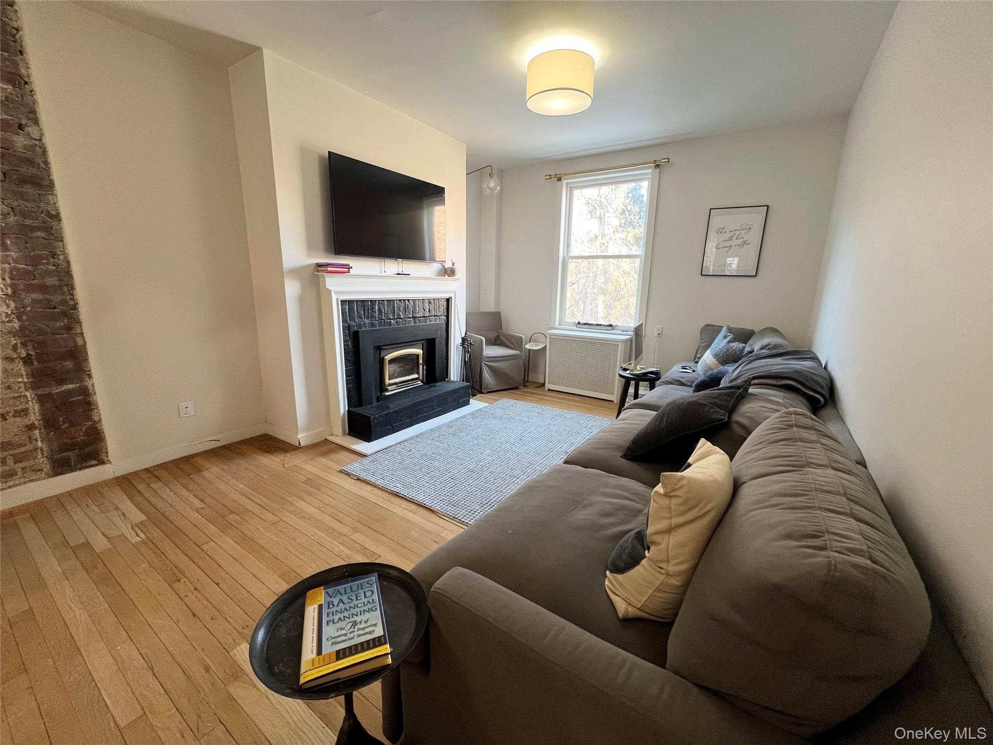 64 Sagamore Road, Unit E6 Bronxville, NY 10708 - Photo 4 of 18 a living room with furniture and a fireplace