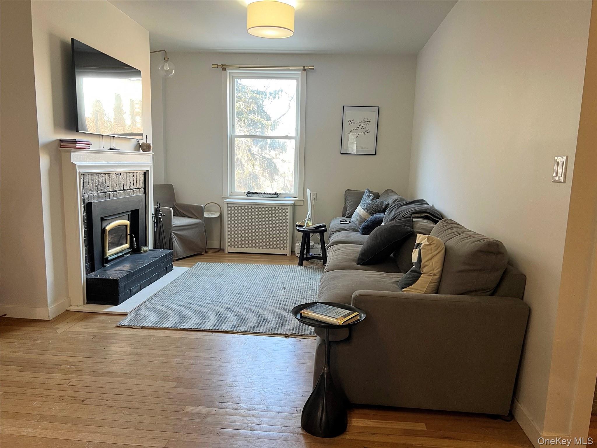 64 Sagamore Road, Unit E6 Bronxville, NY 10708 - Photo 5 of 18 a living room with furniture and a fireplace