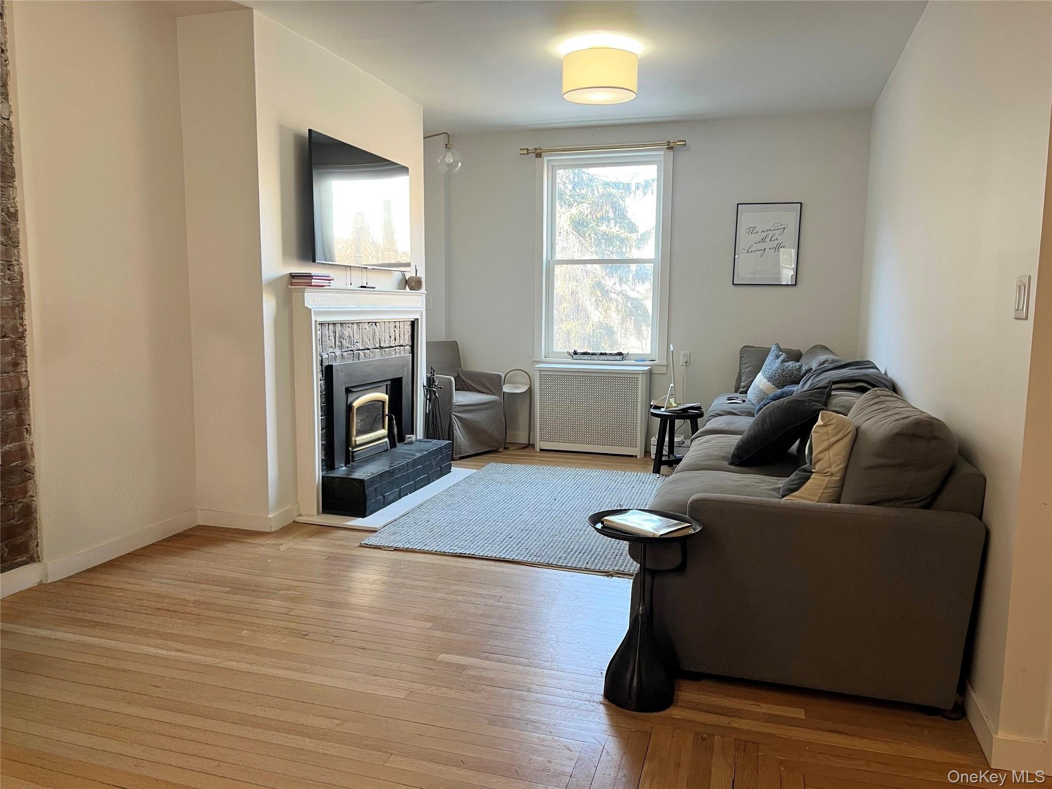 64 Sagamore Road, Unit E6 Bronxville, NY 10708 - Photo 6 of 18 a living room with furniture and a fireplace
