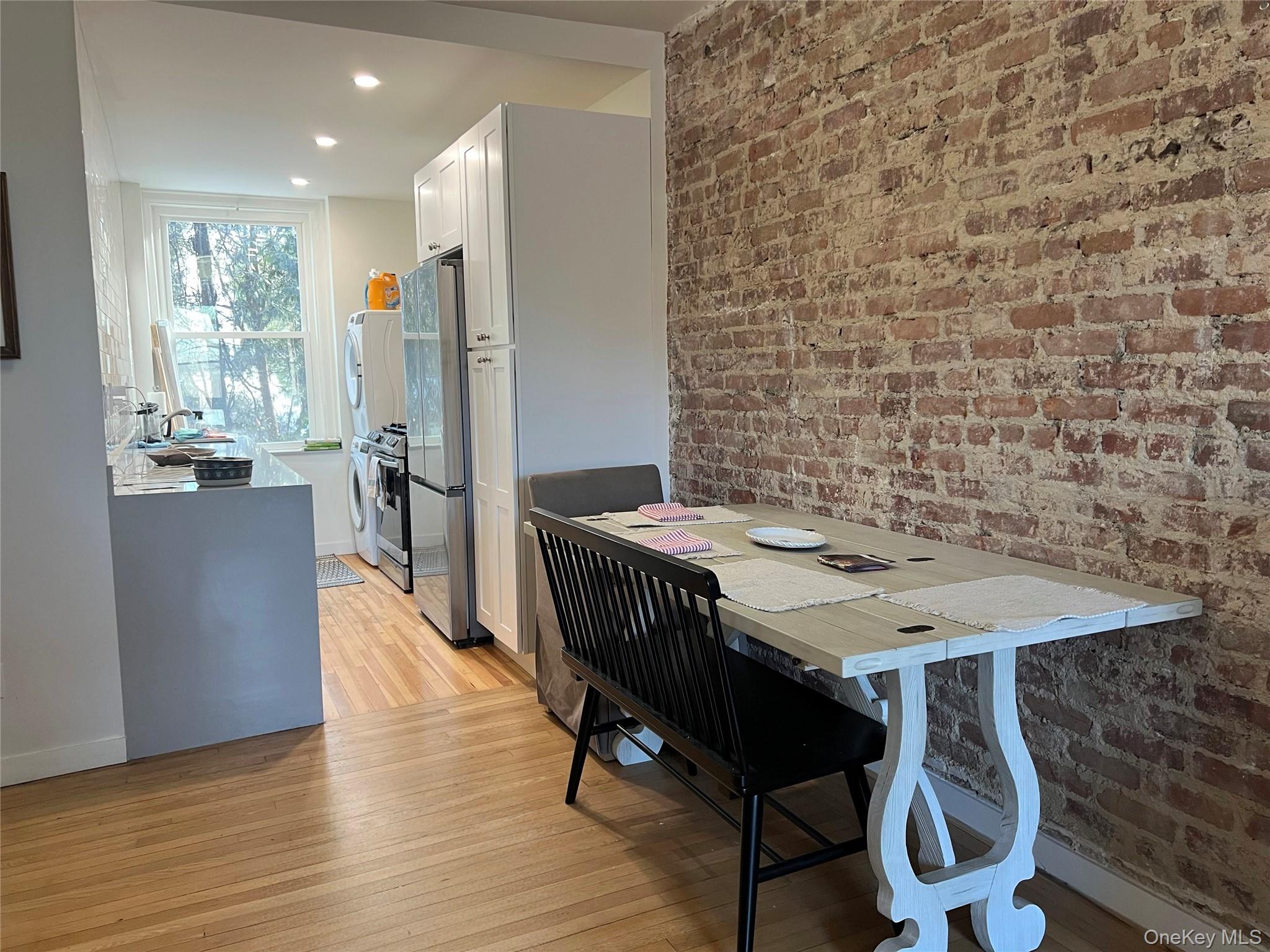 64 Sagamore Road, Unit E6 Bronxville, NY 10708 - Photo 8 of 18 a view of a dining room with furniture window and wooden floor