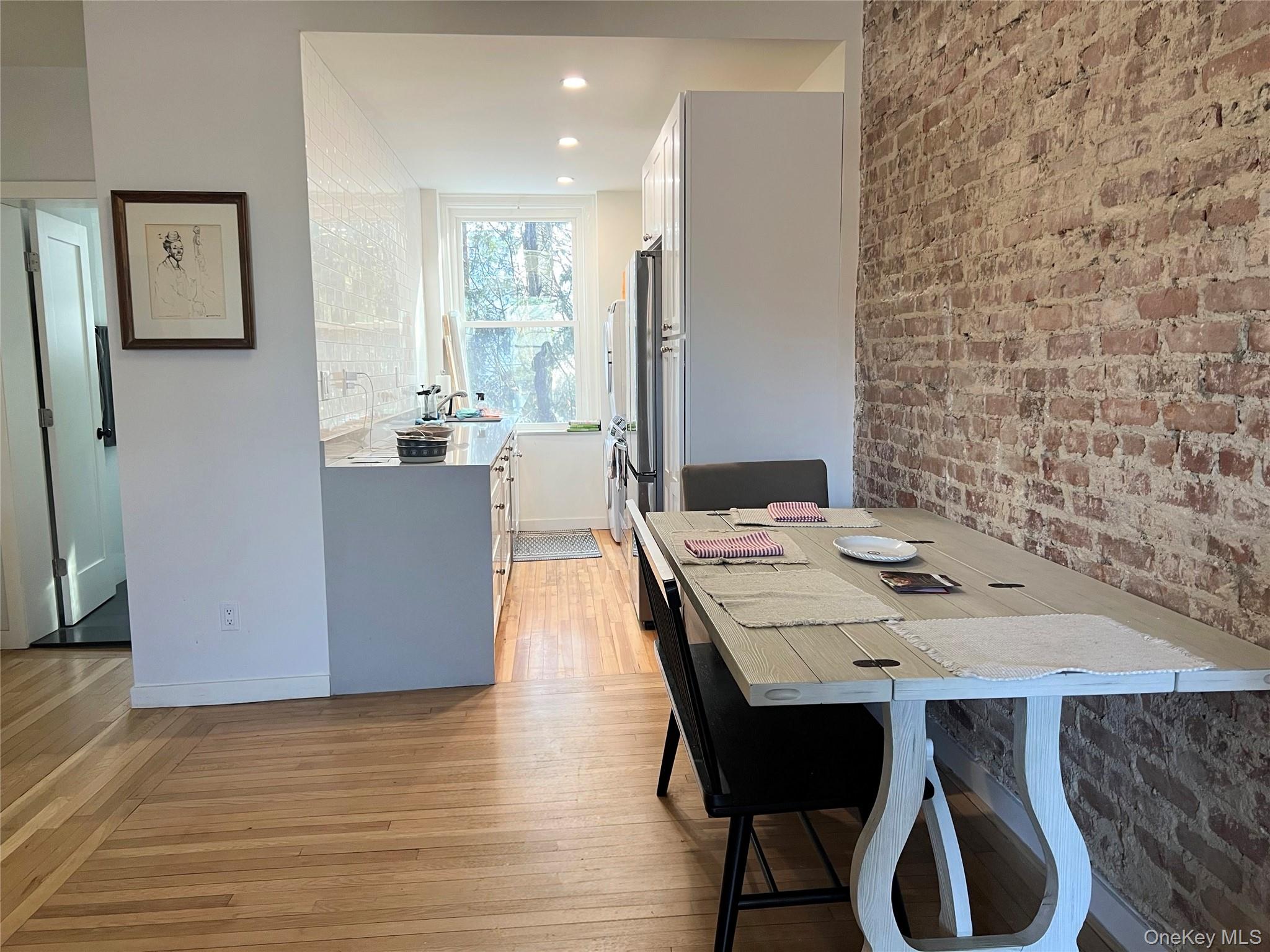 64 Sagamore Road, Unit E6 Bronxville, NY 10708 - Photo 9 of 18 a view of a dining room with furniture and wooden floor