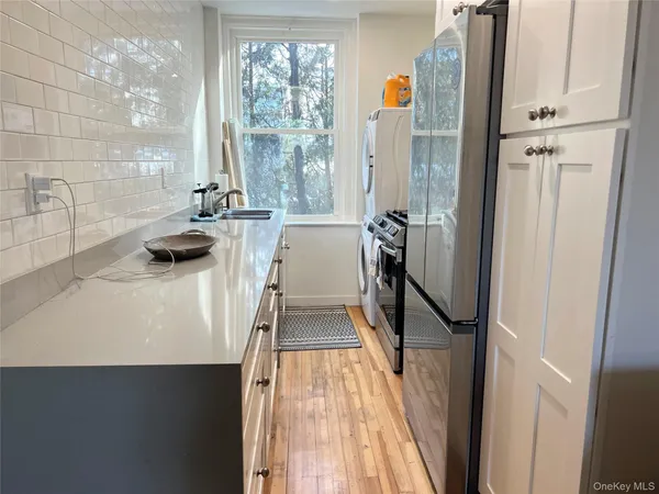 a view of a bathroom with tub and window