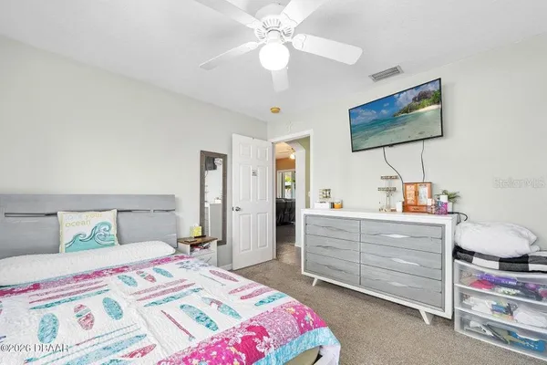 a spacious bathroom with a granite countertop sink toilet and shower