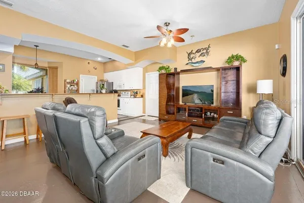 a view of a house with a backyard and porch