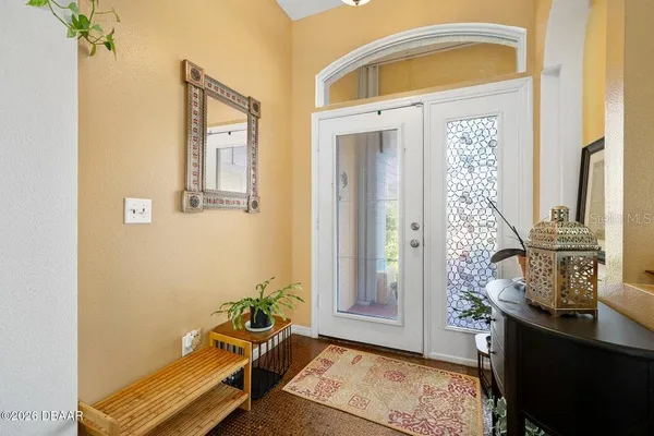 a kitchen with granite countertop a stove a sink and a refrigerator