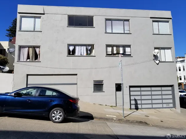 a car parked in front of a building