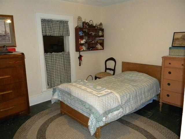 14603 West Coffman Road Forreston, IL 61030 - Photo 8 of 10 a bedroom with a bed and a television