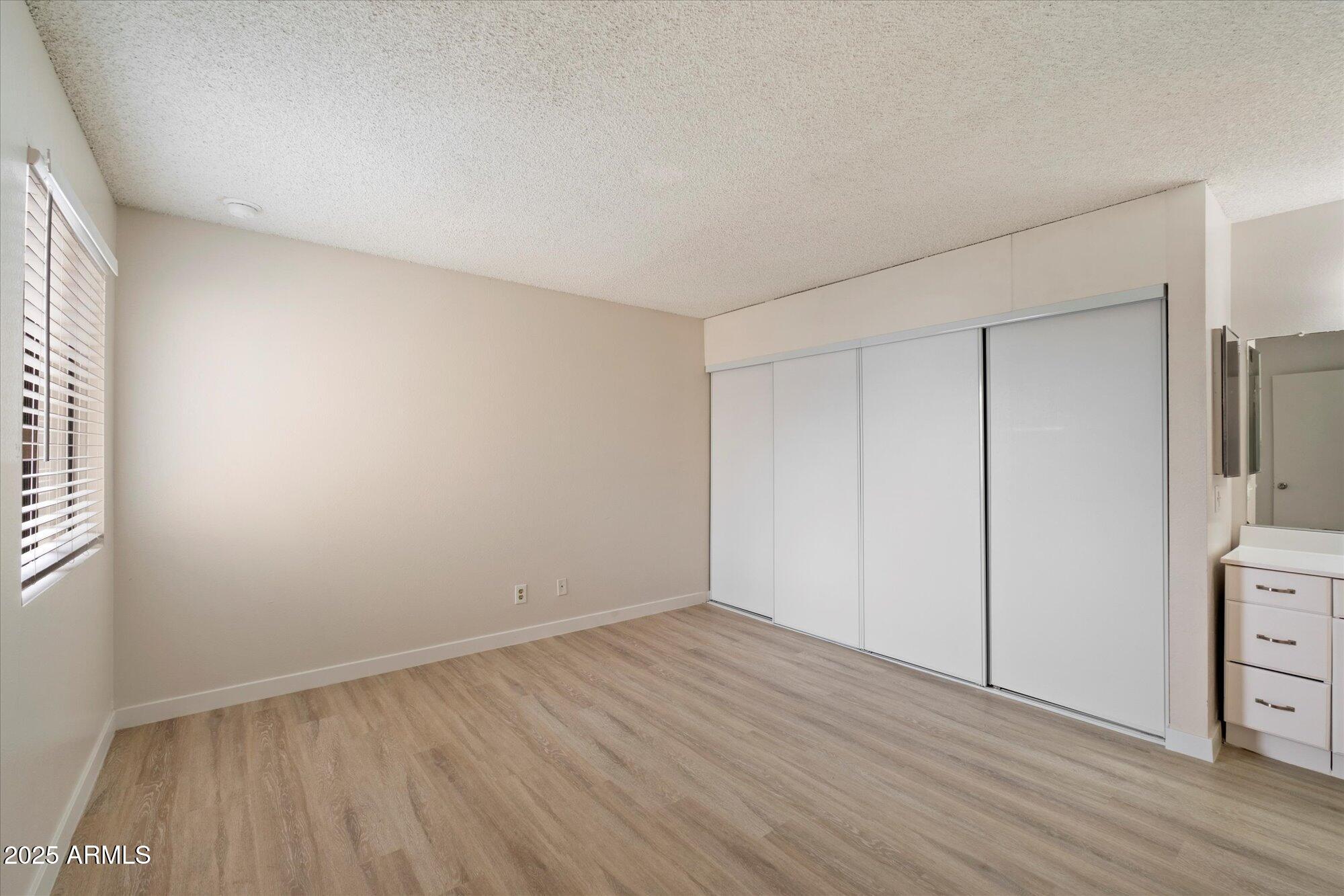 8055 East Thomas Road, Unit A202 Scottsdale, AZ 85251 - Photo 12 of 30 wooden floor in an empty room
