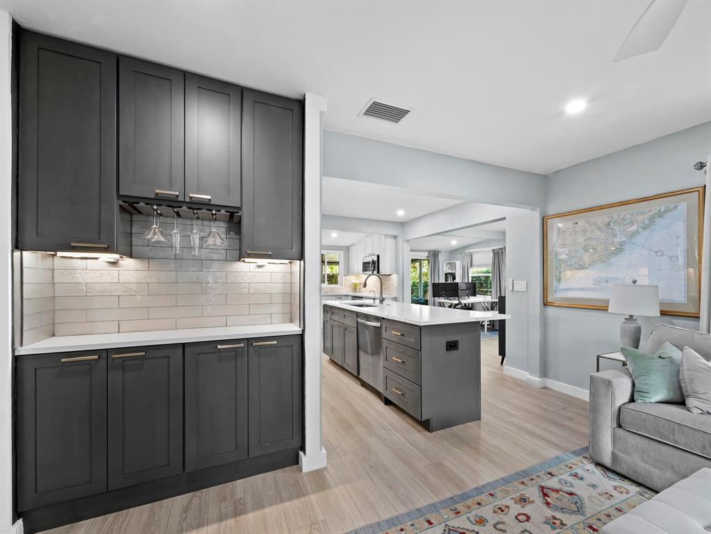 2421 Prospect Street Sarasota, FL 34239 - Photo 2 of 26 a kitchen with stainless steel appliances granite countertop sink stove top oven and cabinets