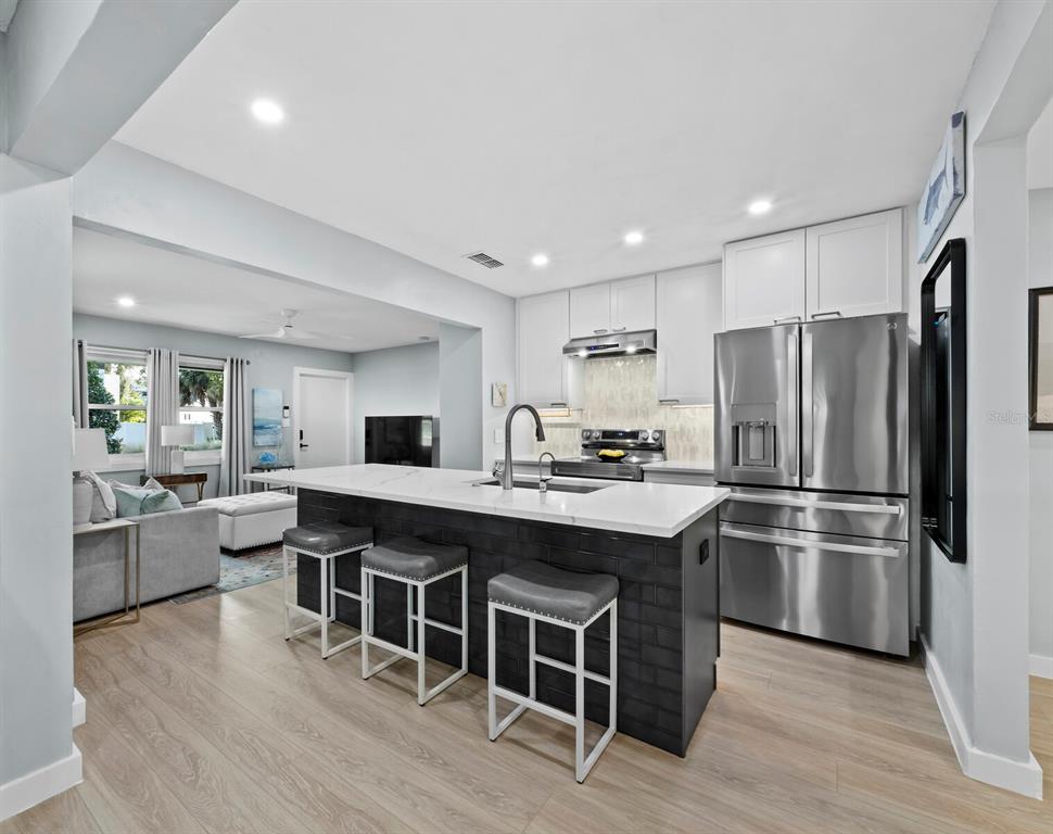 2421 Prospect Street Sarasota, FL 34239 - Photo 4 of 26 a kitchen with stainless steel appliances a sink stove and refrigerator